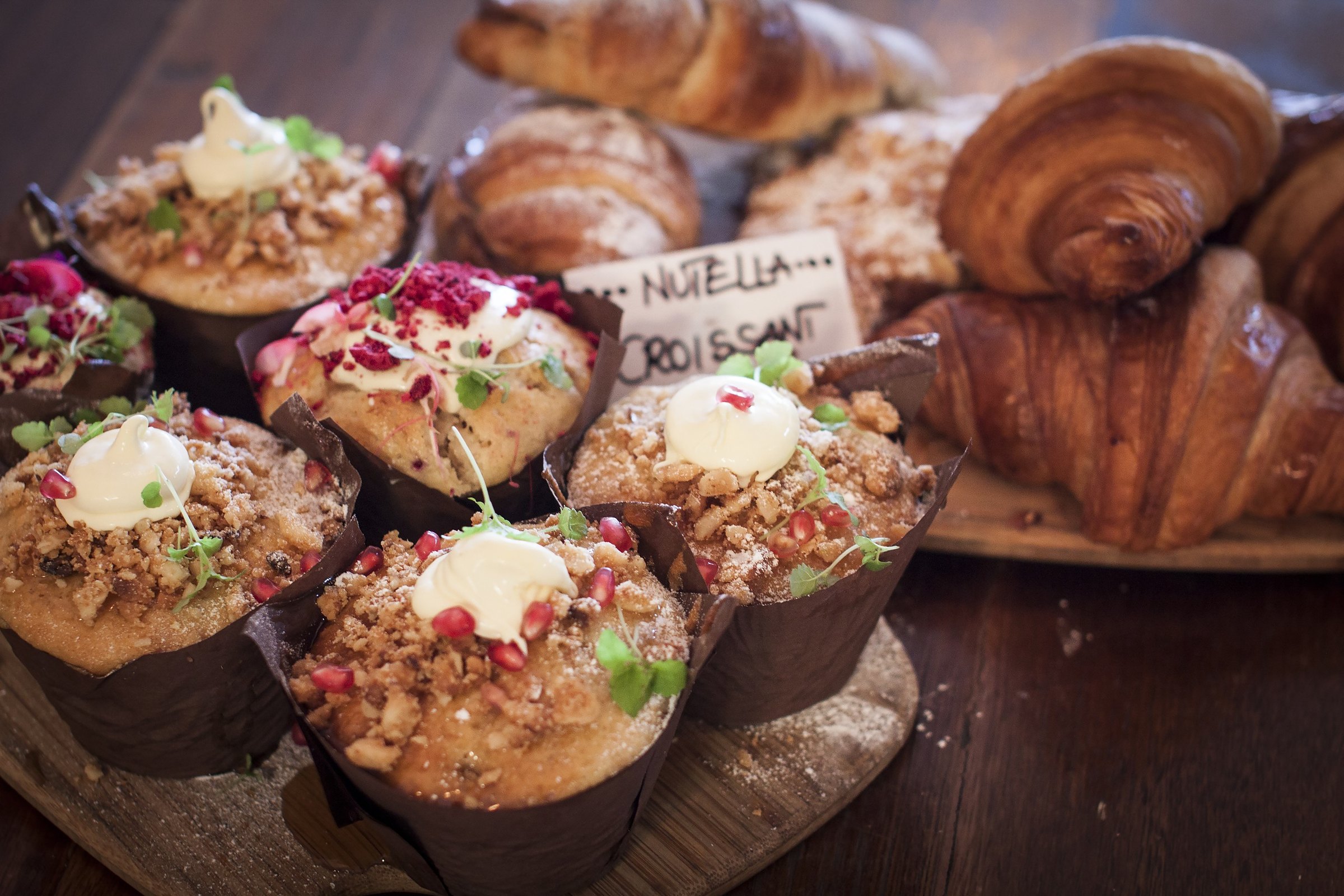 Muffins and croissants on the counter