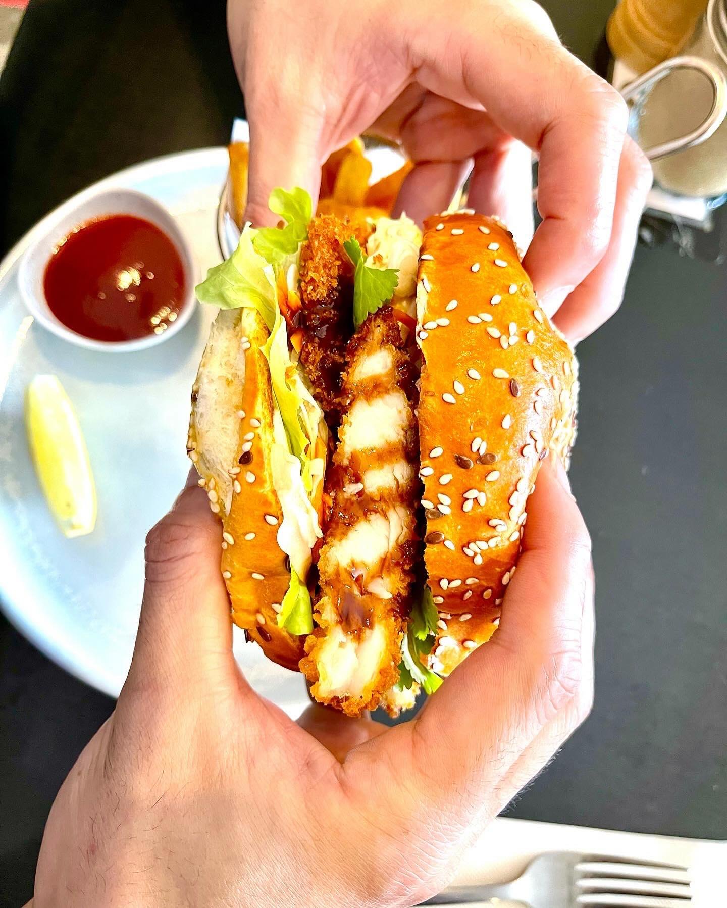 Crispy chicken burger in a sesame brioche bun